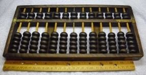 Abacus, pretty old, and original handmade, made of wood and brass.